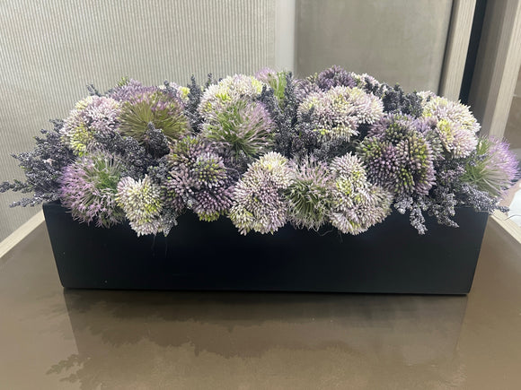 Black Vase with Purple, Green, and White Flower Arrangement Greenery.
