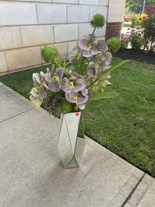 Purple orchid arrangement with mirrored vase