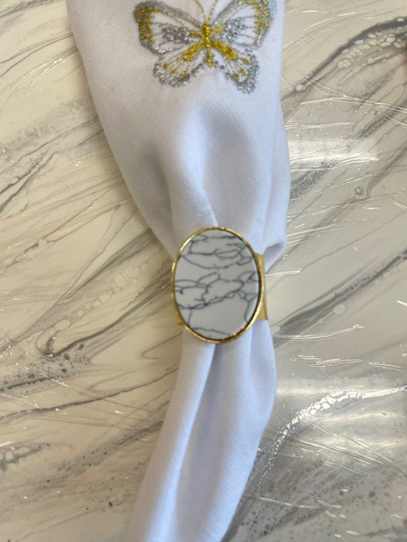 Gold stainless steel napkin ring with white marble piece