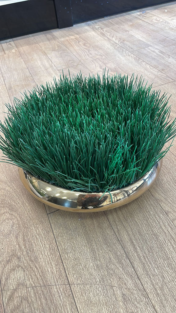 Greenery in gold vase