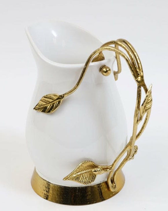 Ceramic pitcher with gold handles