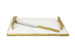 Gold and white marble challah board with knife